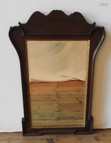 A 19TH CENTURY MAHOGANY FRAMED WALL MIRROR, with gilt foliat...