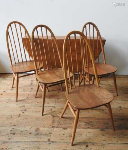 AN ERCOL LIGHT WOOD DROP-LEAF TABLE AND FOUR ERCOL HIGH BACK...