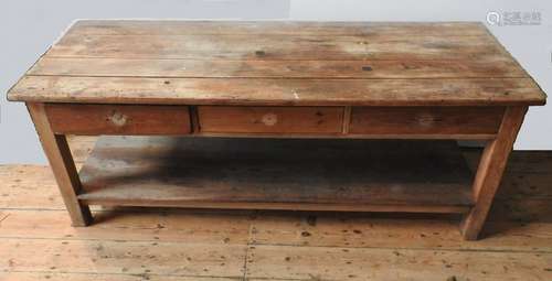 A RUSTIC PINE FARMHOUSE PLANK TOP DRESSER BASE, with three d...