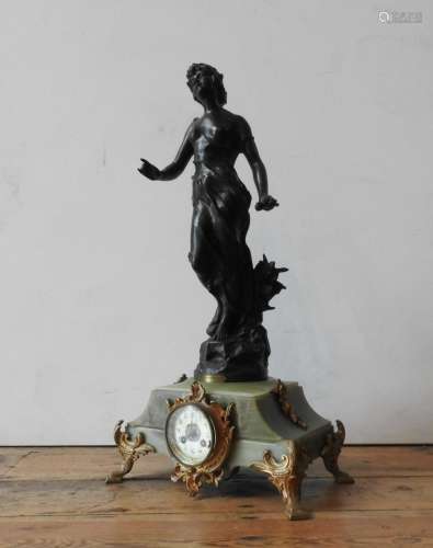A 19TH CENTURY ONYX MANTLE CLOCK WITH LARGE CAST METAL FIGUR...