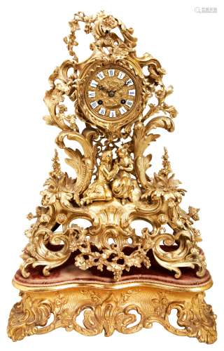A FRENCH EARLY 19TH CENTURY ORNATE BRASS MANTEL CLOCK, the b...