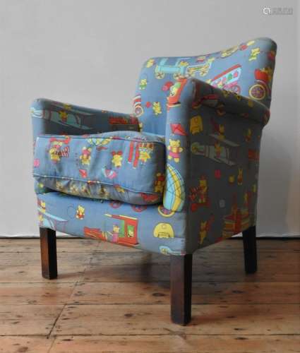 A CHILD'S NURSERY ARMCHAIR UPHOLSTERED WITH TEDDY BEAR PATTE...