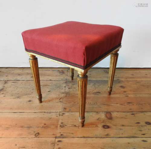 A CONTINENTAL 19TH CENTURY GILT WOODEN STOOL, the upholstere...