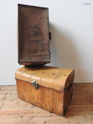 A VINTAGE TIN TRUNK AND A VINTAGE CANVAS COVERED TRUNK