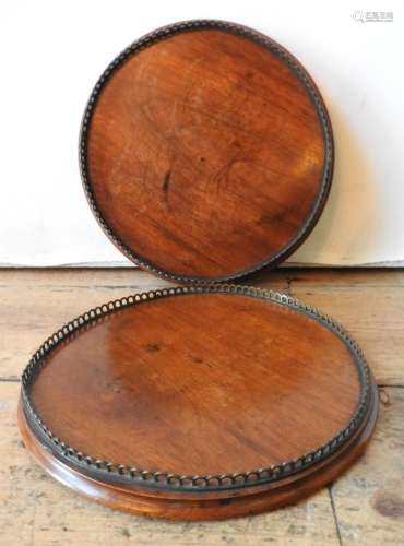 A PAIR OF 19TH CENTURY MAHOGANY CIRCULAR TRAYS, with gallery...