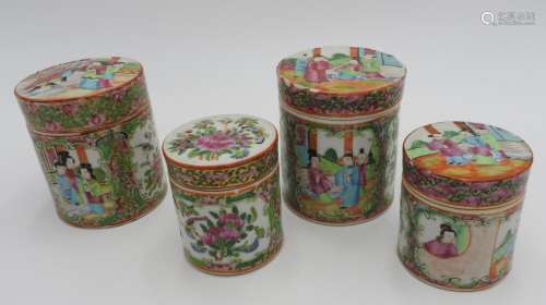 FOUR 19TH CENTURY FAMILLE ROSE DECORATED JARS WITH LIDS, the...