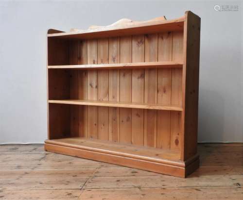A PINE FOUR TIER BOOKSHELF, with serpentine gallery back, 10...