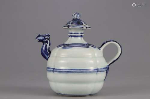 A BLUE AND WHITE KETTLE