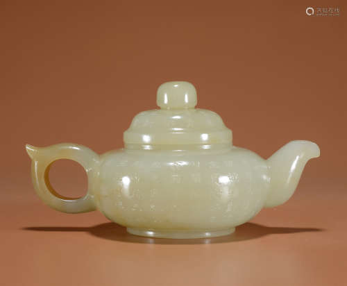 A WHITE JADE TEA POT PAINTED WITH POETRY