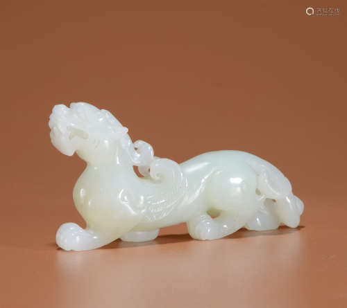 A WHITE JADE ORNAMENT SHAPED WITH BEAST