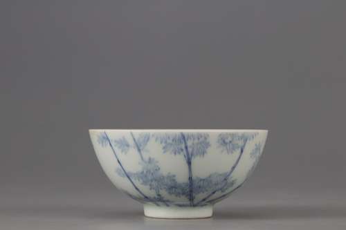 A BLUE AND WHITE BOWL WITH BAMBOO PATTERNS