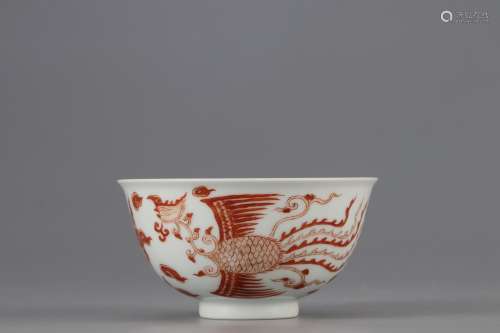 AN ALUM RED BOWL WITH PHOENIX PATTERNS