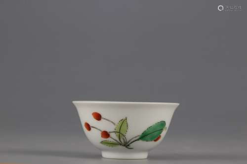 A MUTICOLORED CUP PAINTED WITH BUTTERFLY PATTERNS