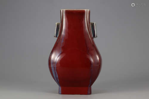 A RED GLAZE BOTTLE WITH PIERCED HANDLES
