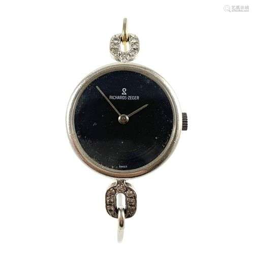 MONTRE RICHARDS ZEGER Bracelet jonc en or. Boitier rond orné...