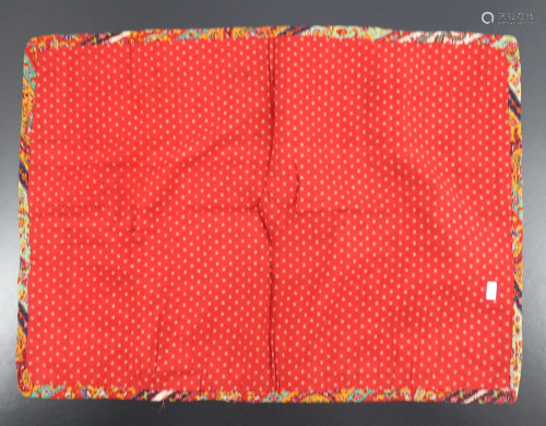 A finely embroidered rectangular cover,