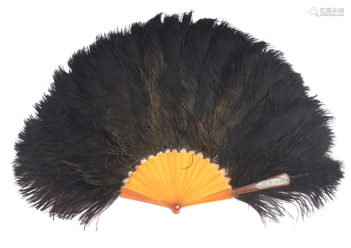 A large black ostrich feather fan, 1890