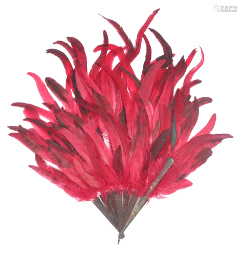 A vibrant red feather fan early 20th cen