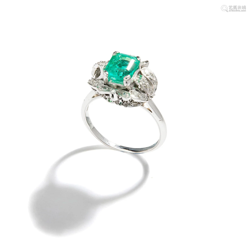 An emerald and diamond ring