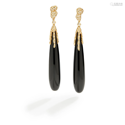 A pair of onyx and diamond earrings