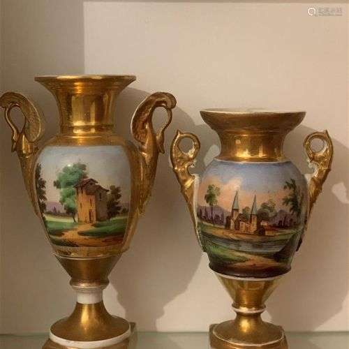 Deux vases en porcelaine polychrome et dorée de forme balust...