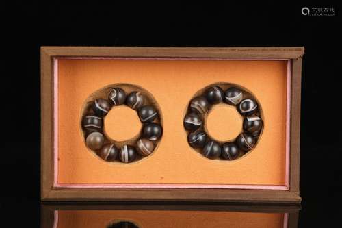 A Set Of Two Dzi Beads