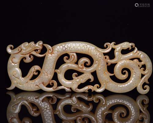 A Jade Carved Dragon And Phoenix Pendant