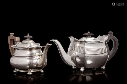 A lot comprising two silver teapots. London, 19th century. D...