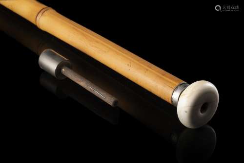 A bamboo blowgun walking stick with an ivory knob. Silver mo...