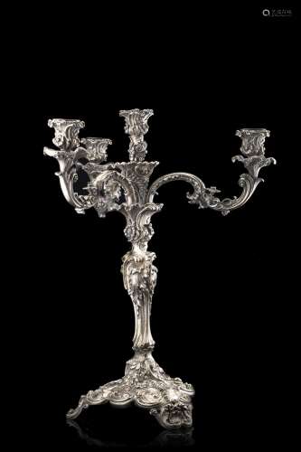 A silvered metal four-light candelabra engraved "In Deo...