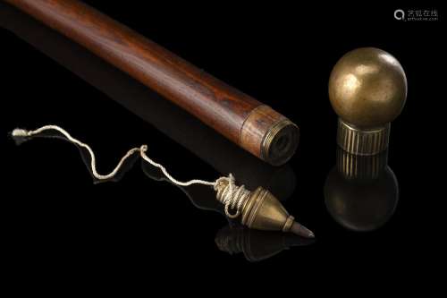 A wooden walking stick hiding a lead weight in the brass kno...