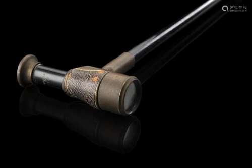 An early 20th-century French ebony walking stick with brass ...