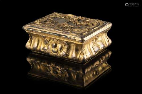 A chiselled gilt metal box (cm 7x3,5x6)...