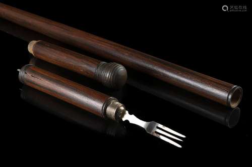 A late 19th-century malacca walking stick enclosing a fork. ...