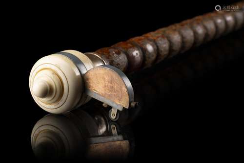 A palm smoker walking stick hiding a lighter in the ivory kn...