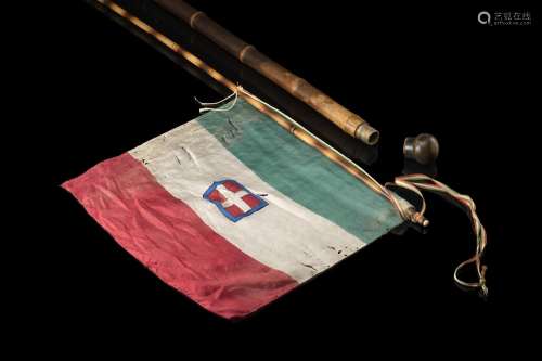 A bamboo walking stick enclosing the Italian flag. Ivory mou...