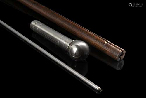 A wooden bow-shaped walking stick hiding a dart in the silve...