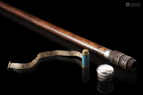 An early 20th-century malacca walking stick with carved wood...