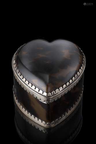 A heart-shaped tortoiseshell box with silver mounts. Birming...