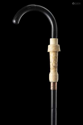 A late 19th-century ebony walking stick with a detachable iv...