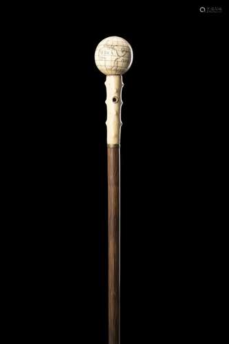 A late 19th-century bamboo walking stick with ivory handle i...