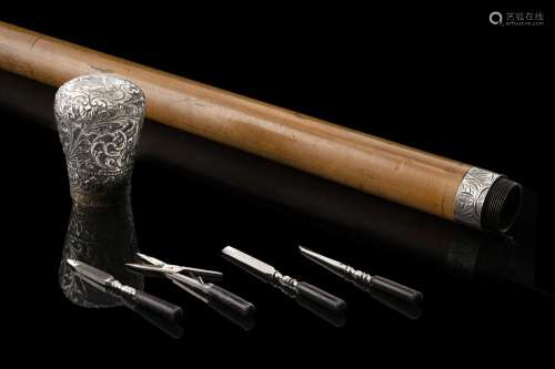 A malacca walking stick with chiselled silvered metal handle...