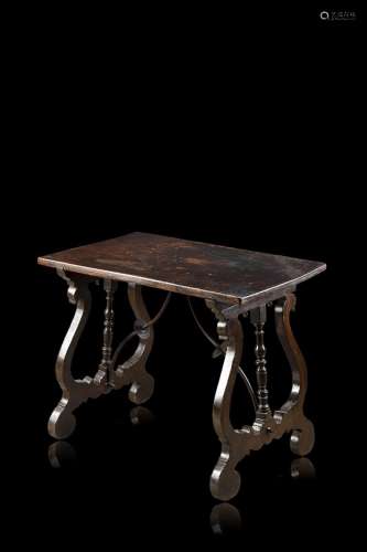 A carved wooden table (cm 66,54,5x42,5) (defects)...