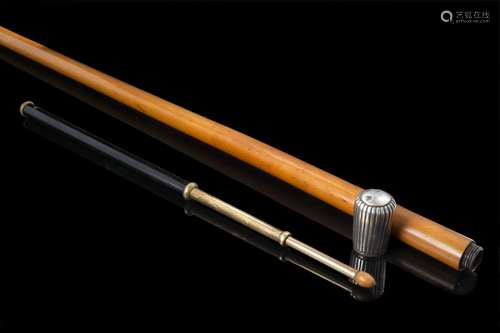 A 20th-century conductor malacca walking stick with silver h...