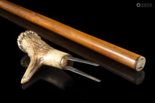 A 19th-century French malacca walking stick with deer horn h...