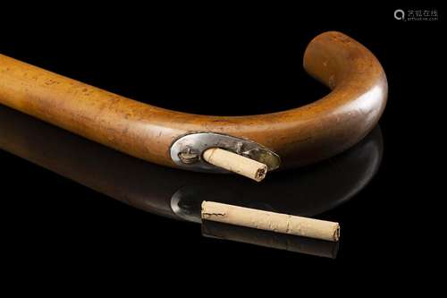 An early 20th-century smoker malacca walking stick enclosing...