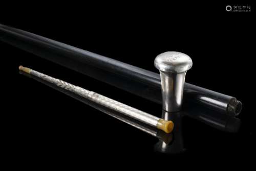 An early 20th-century English ebony walking stick with silve...