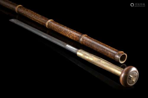 A bamboo cheese taster walking stick hiding a brass rod in t...