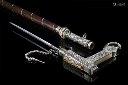 A 20th-century malacca walking stick with a silver and bone ...