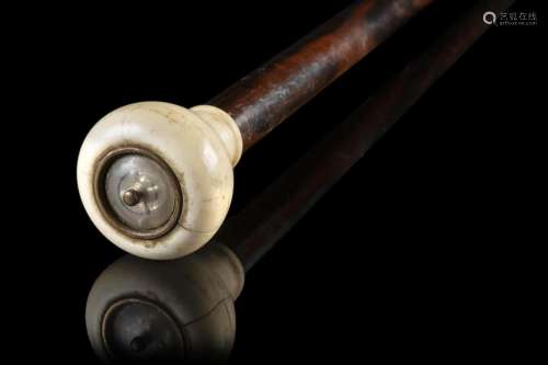 An ebony gamer walking stick hiding a roulette game in the i...